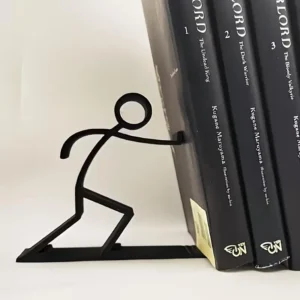Serre-livres bonhomme qui pousse les livres – vue 2 Serre-livres bonhomme qui pousse les livres – vue 2